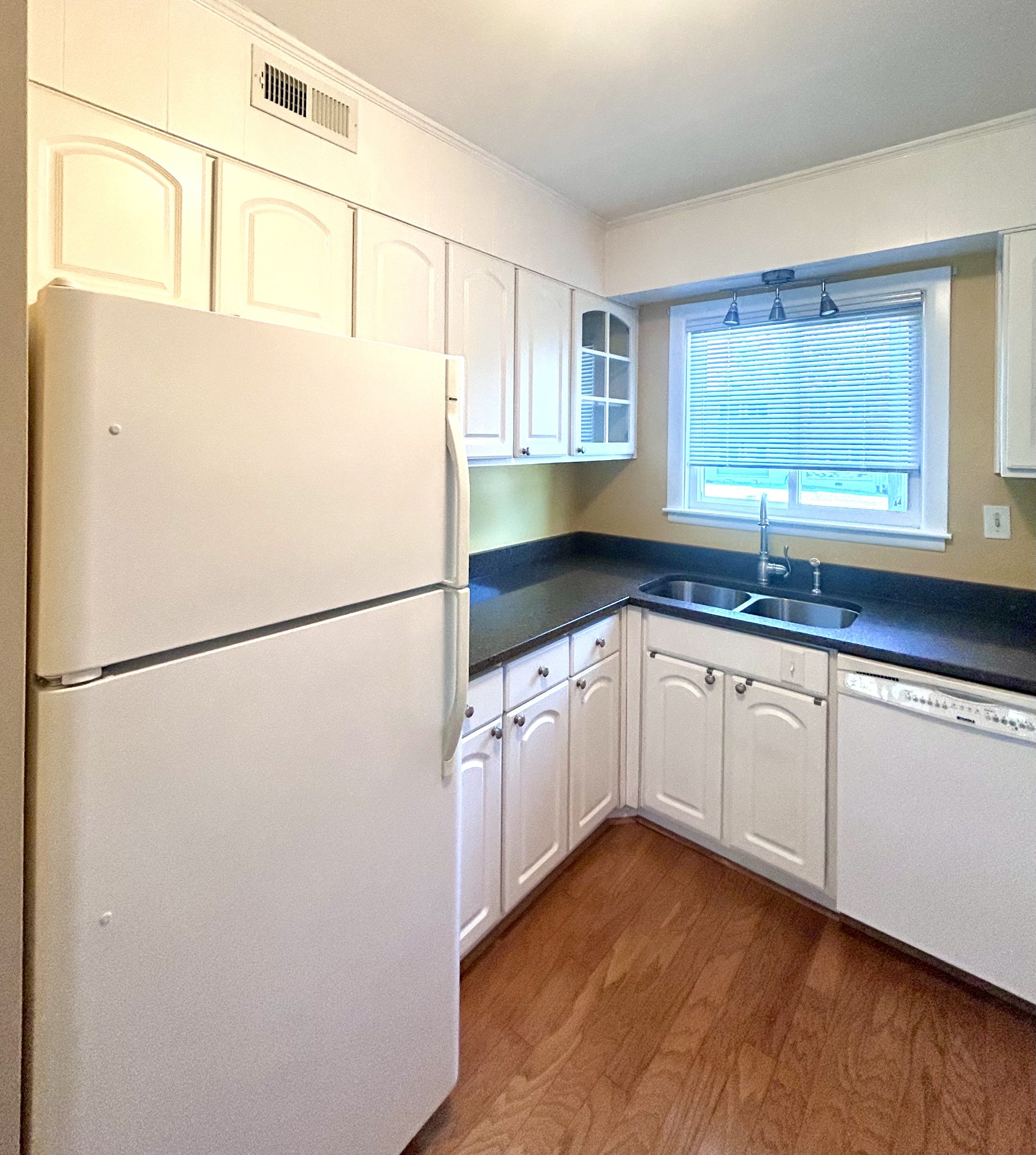1900 Richard Jones Road, Unit D2 Nashville, TN 37215 - Photo 3 of 7 a white refrigerator freezer sitting inside of a kitchen