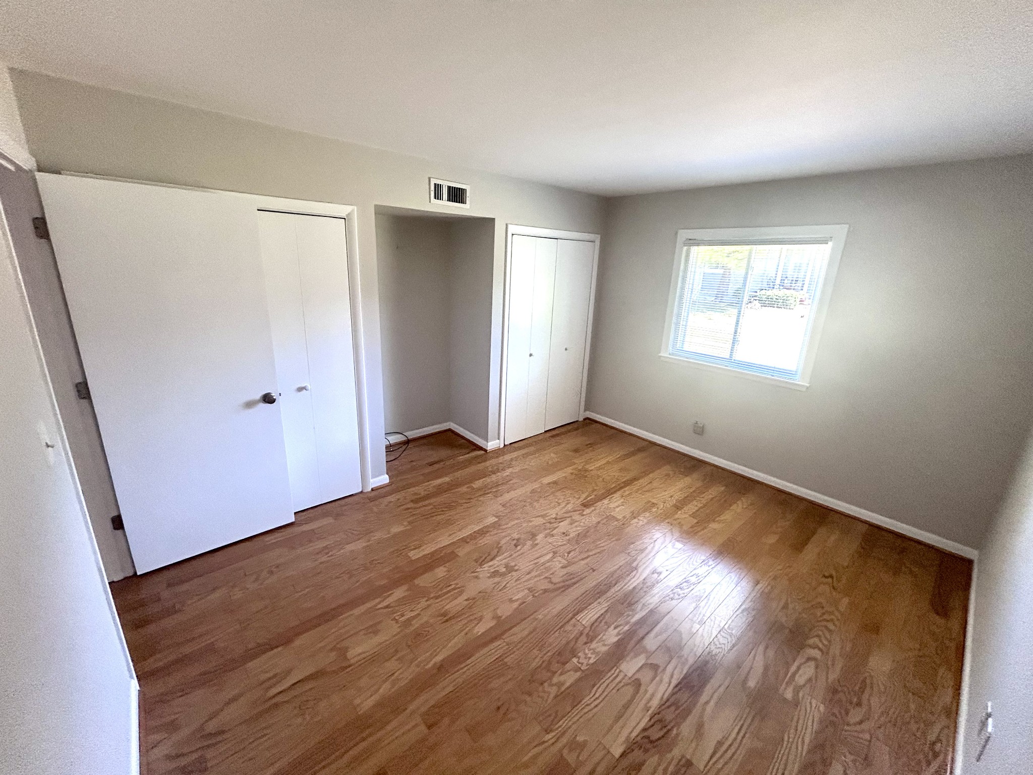 1900 Richard Jones Road, Unit D2 Nashville, TN 37215 - Photo 5 of 7 an empty room with wooden floor and windows