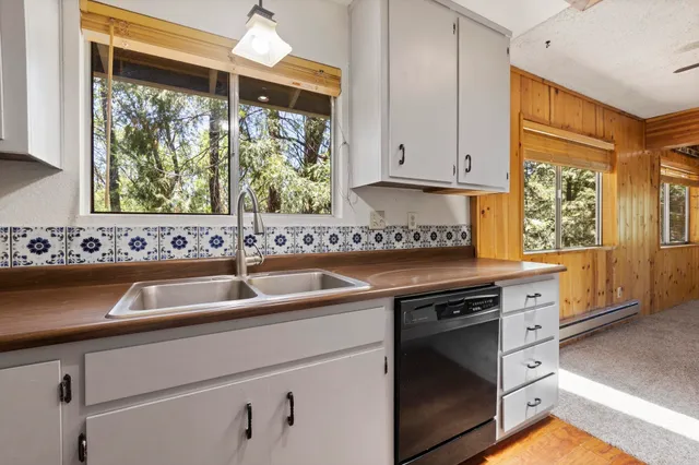 a view of a livingroom with a ceiling fan and window