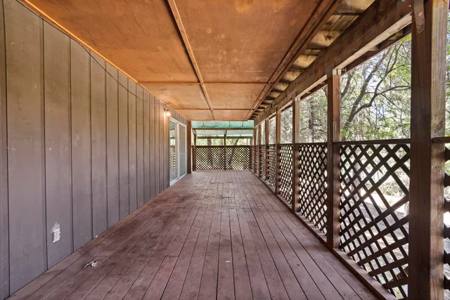 a view of a street with trees in front of it