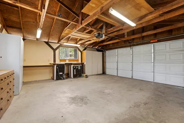 a balcony with wooden floor and trees