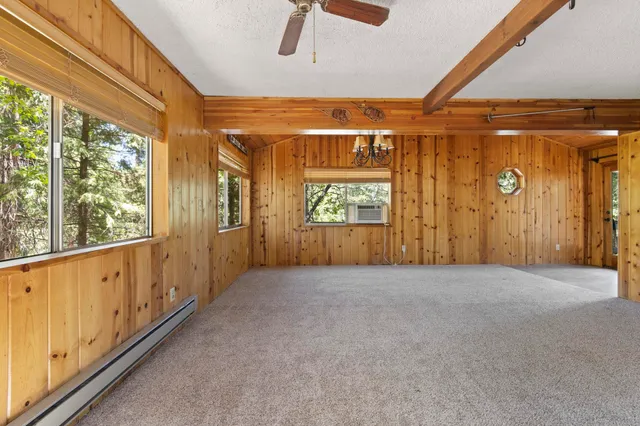 a view of a room with large windows