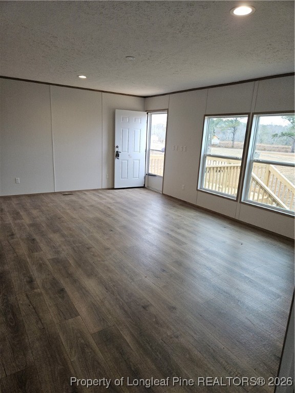 1693 Odum Road Lumberton, NC 28360 - Photo 3 of 21 an empty room with wooden floor and windows