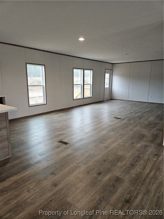 1693 Odum Road Lumberton, NC 28360 - Photo 4 of 21 an empty room with wooden floor and windows