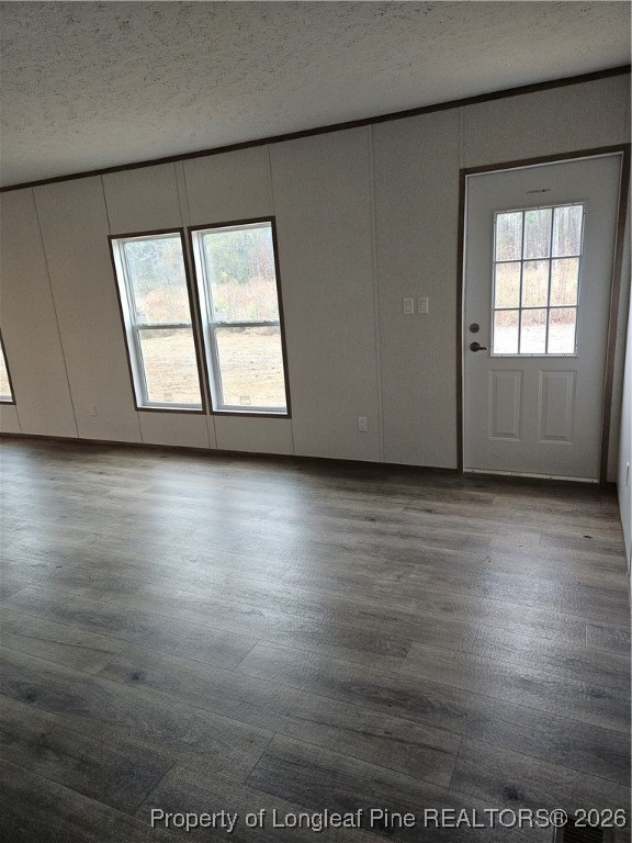 1693 Odum Road Lumberton, NC 28360 - Photo 5 of 21 an empty room with wooden floor and windows