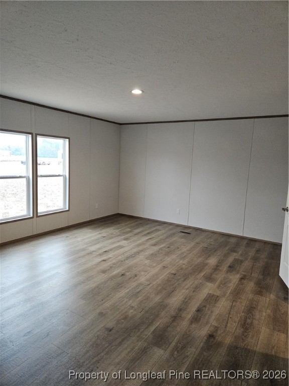 1693 Odum Road Lumberton, NC 28360 - Photo 6 of 21 an empty room with wooden floor and windows