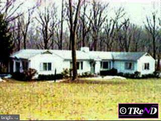 1159 Seaton Ross Road Wayne, PA 19087 - Photo 1 of 1 a front view of a building with garden