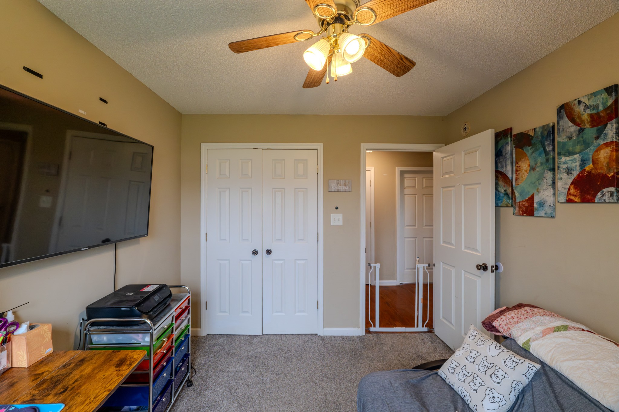 1735 Hazelwood Road Clarksville, TN 37042 - Photo 11 of 23 a bedroom with a bed and a chandelier