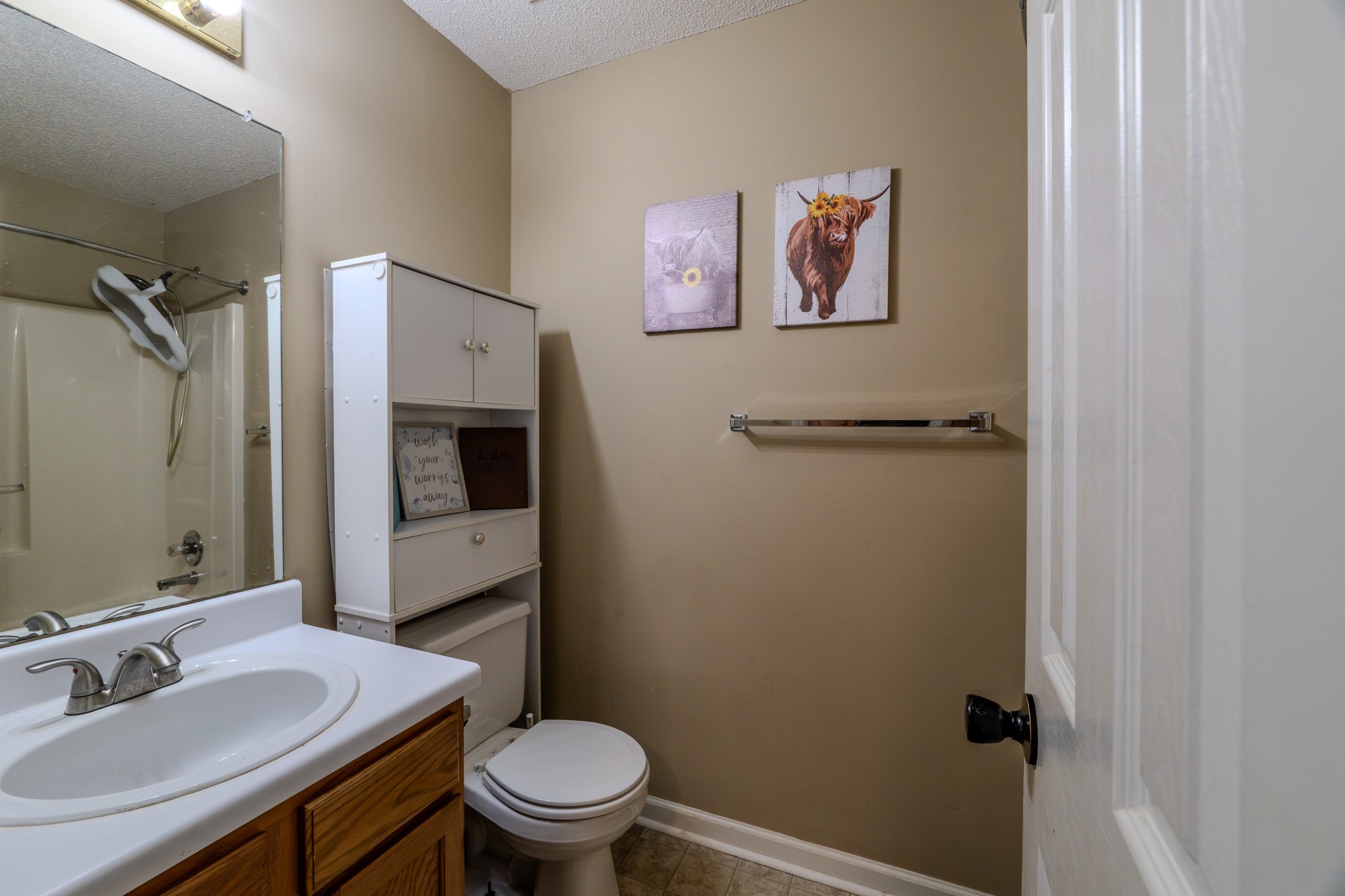 1735 Hazelwood Road Clarksville, TN 37042 - Photo 12 of 23 a bathroom with a toilet sink and mirror