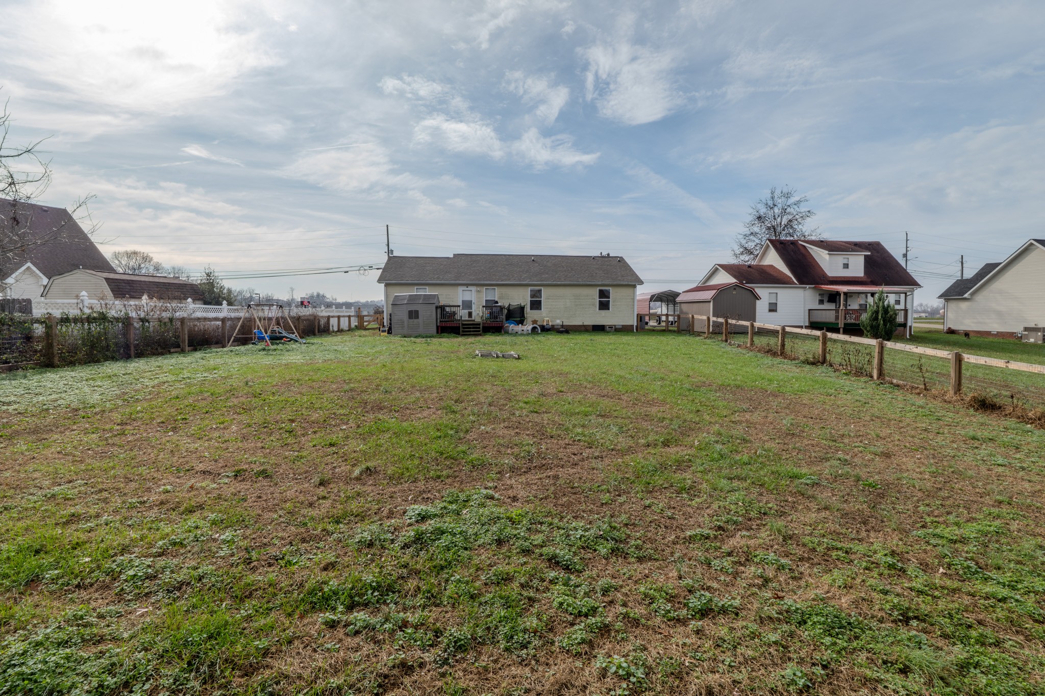 1735 Hazelwood Road Clarksville, TN 37042 - Photo 18 of 23 a view of a big house with a big yard and a large tree
