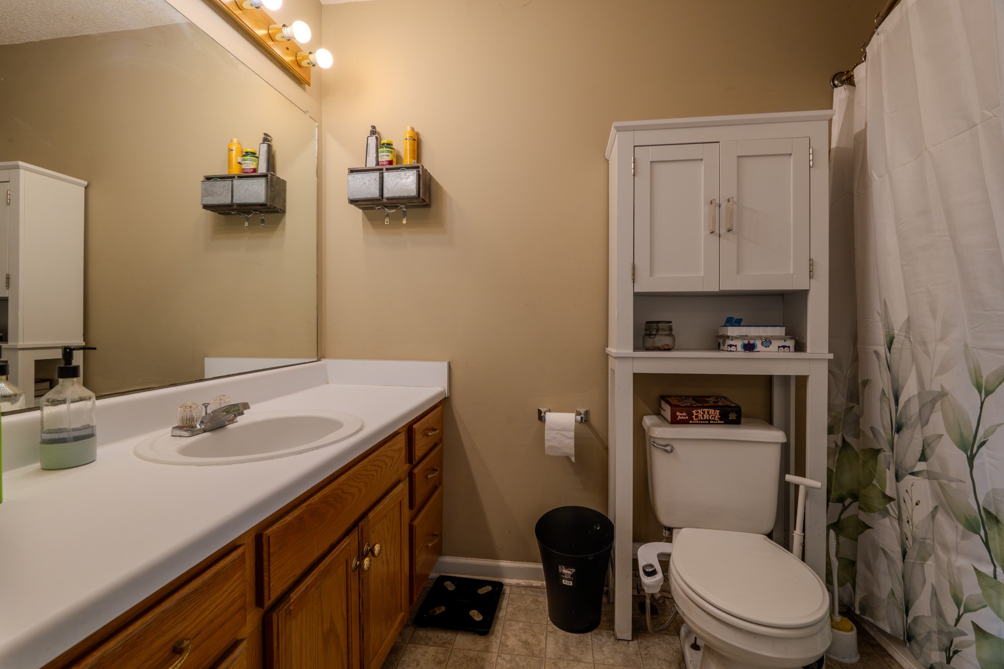 1735 Hazelwood Road Clarksville, TN 37042 - Photo 8 of 23 a bathroom with a granite countertop sink toilet and mirror