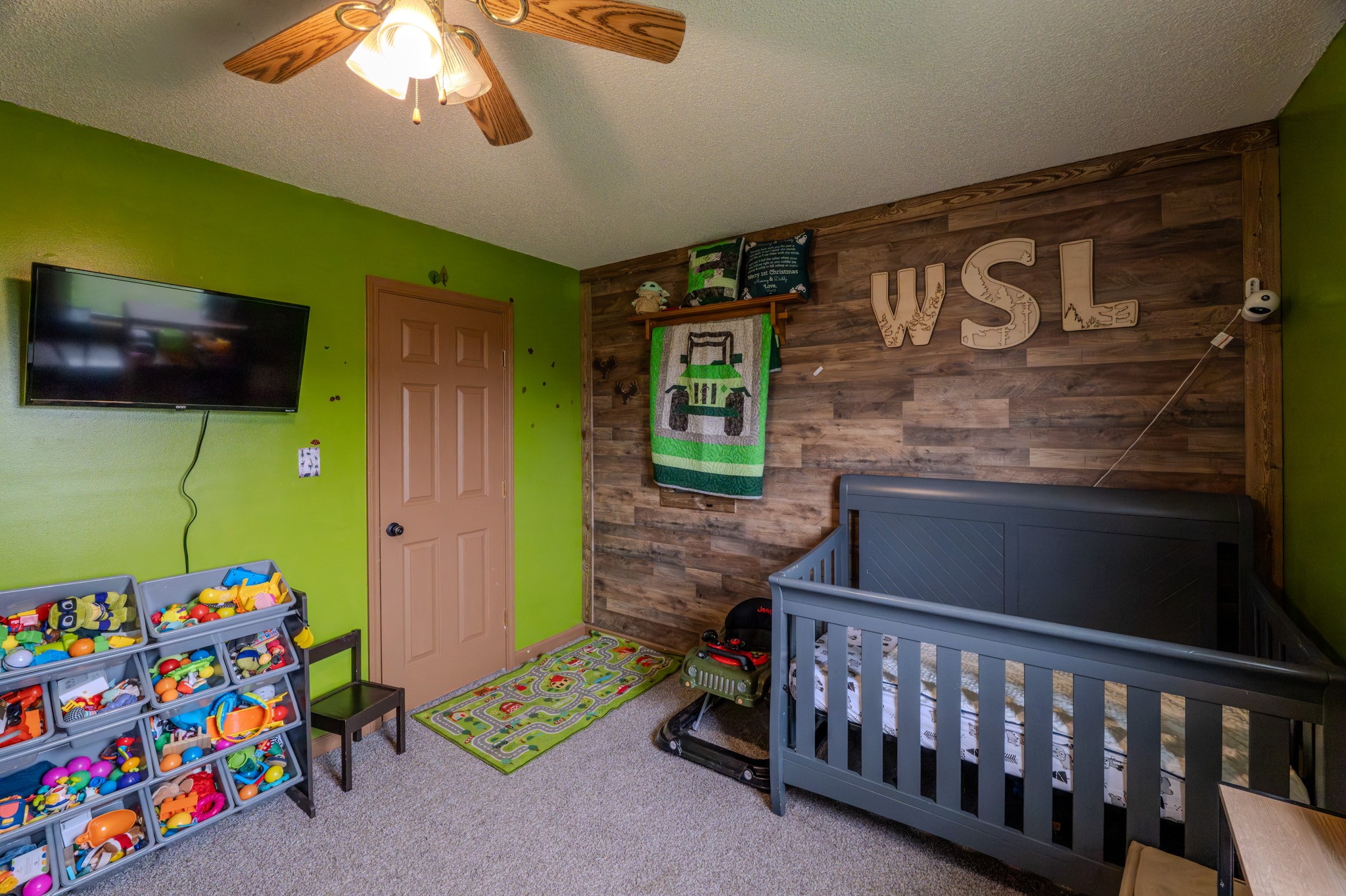 1735 Hazelwood Road Clarksville, TN 37042 - Photo 9 of 23 a view of kids room with a baby crib