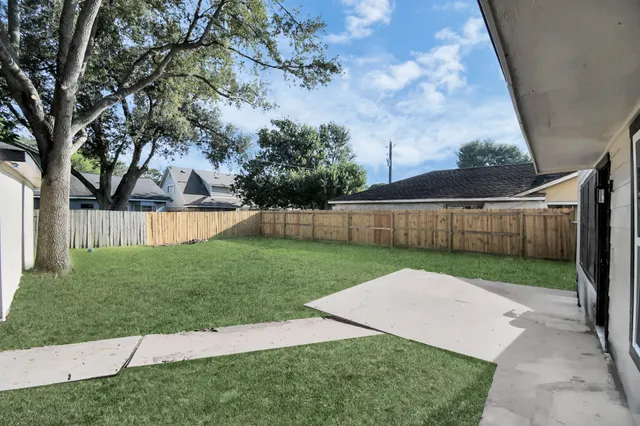 a view of a backyard with a small cabin