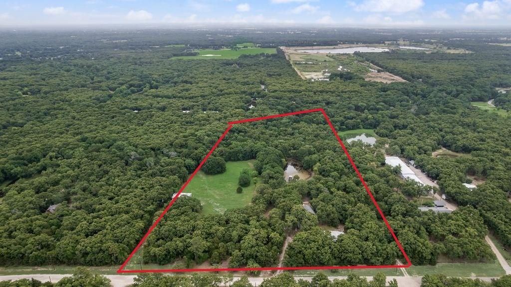 9875 Old Bridge Road Terrell, TX 75160 - Photo 2 of 40 a view of a garden with an buildings and street view