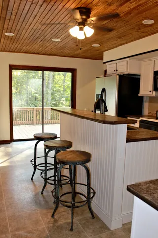 a view of a dining room with furniture and window