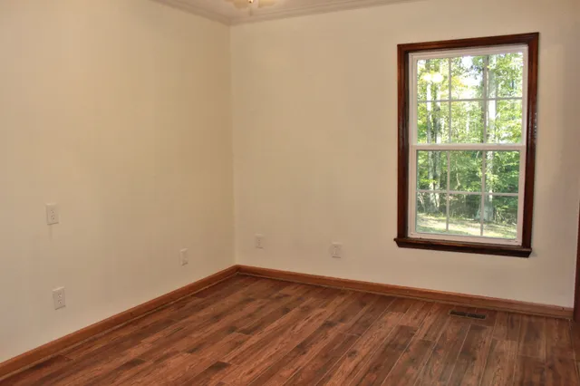 a white toilet sitting next to a window
