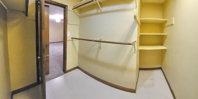 a view of wooden floor and a window