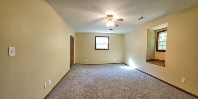 an empty room with windows