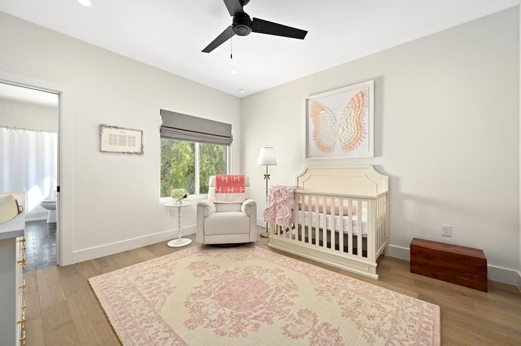 5212 Huisache Street, Unit 2 Austin, TX 78751 - Photo 24 of 30 Bedroom featuring a nursery area, a ceiling fan, light wood finished floors, and recessed lighting