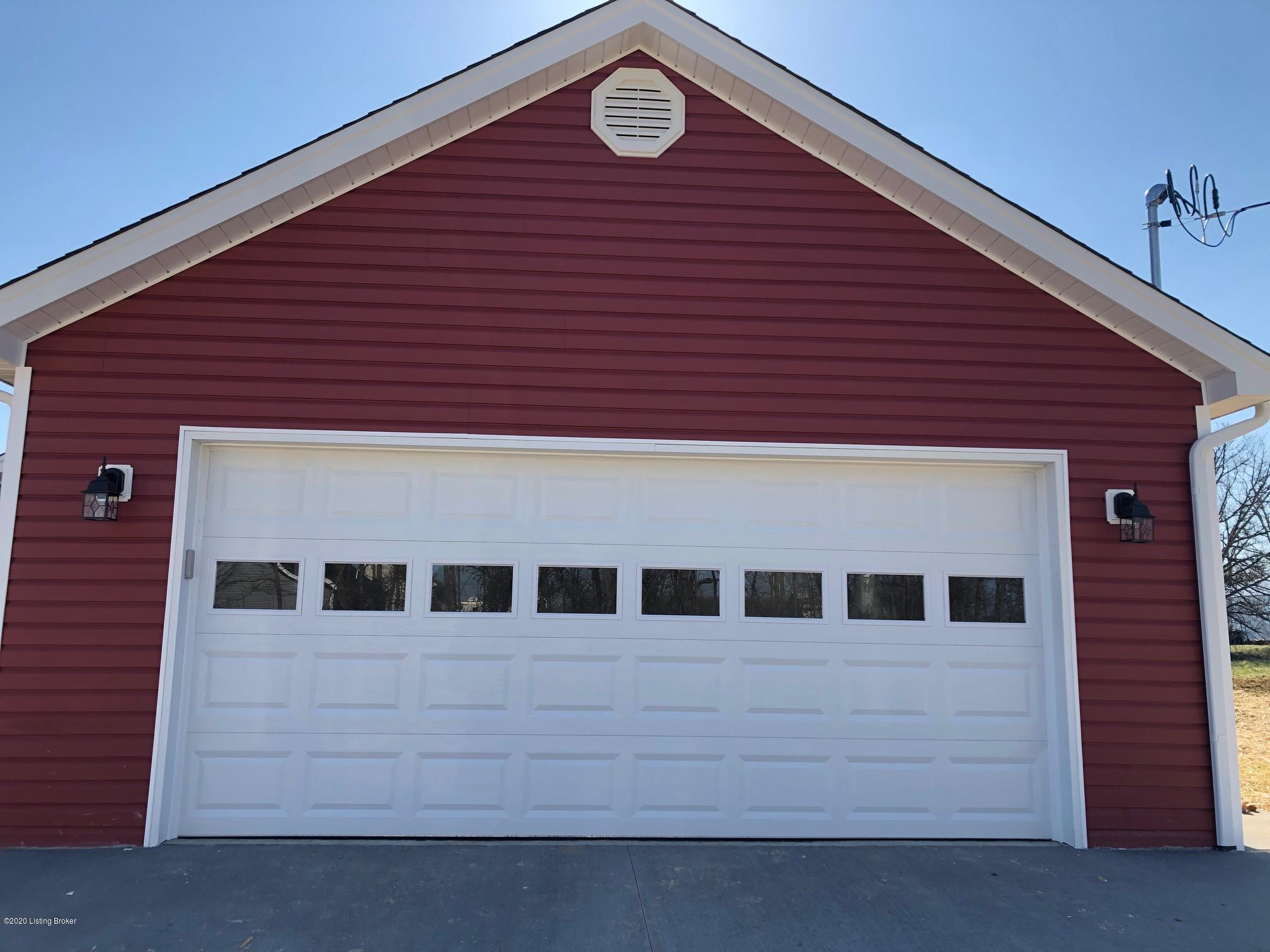 126 Ridge Point Drive Brandenburg, KY 40108 - Photo 2 of 18 red garage door
