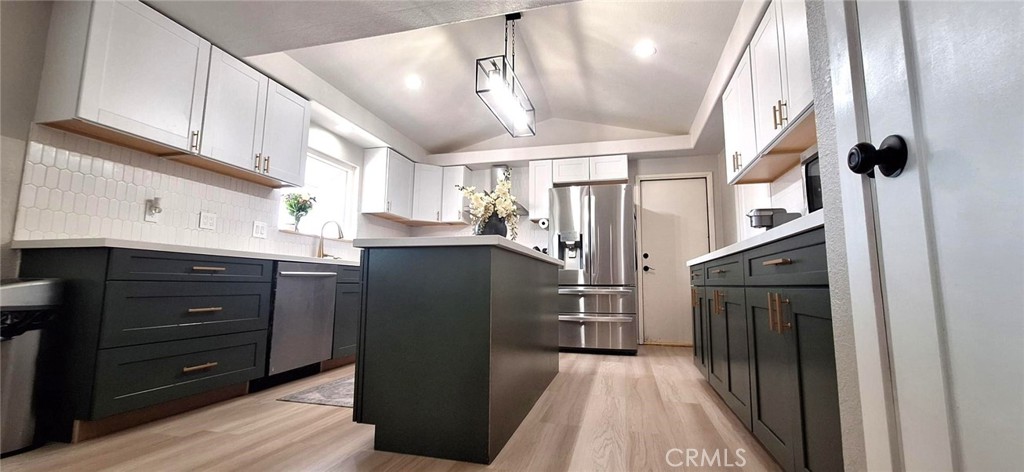 14822 Crofton Lane Helendale, CA 92342 - Photo 11 of 33 a kitchen with a refrigerator and a sink