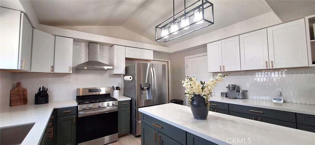 14822 Crofton Lane Helendale, CA 92342 - Photo 14 of 33 a kitchen with stainless steel appliances a sink a stove and refrigerator