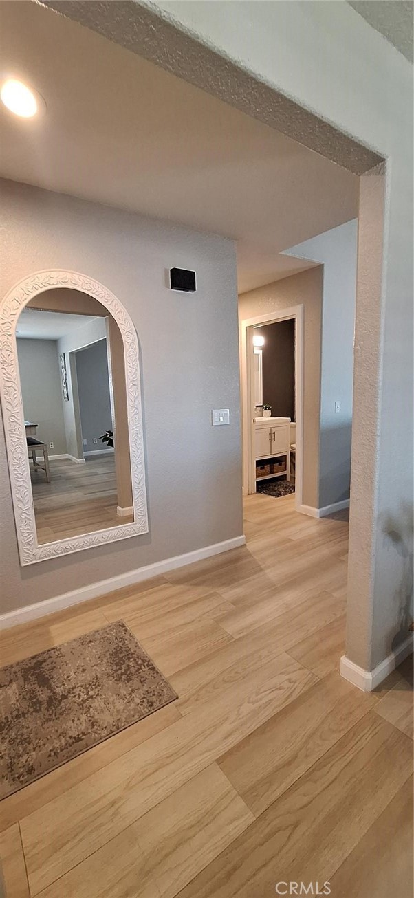 14822 Crofton Lane Helendale, CA 92342 - Photo 18 of 33 a view of a livingroom with wooden floor and a cabinet