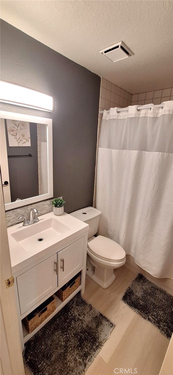 14822 Crofton Lane Helendale, CA 92342 - Photo 20 of 33 a bathroom with a toilet sink and mirror