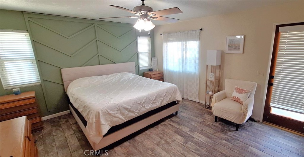 14822 Crofton Lane Helendale, CA 92342 - Photo 26 of 33 a bedroom with a bed and a couch