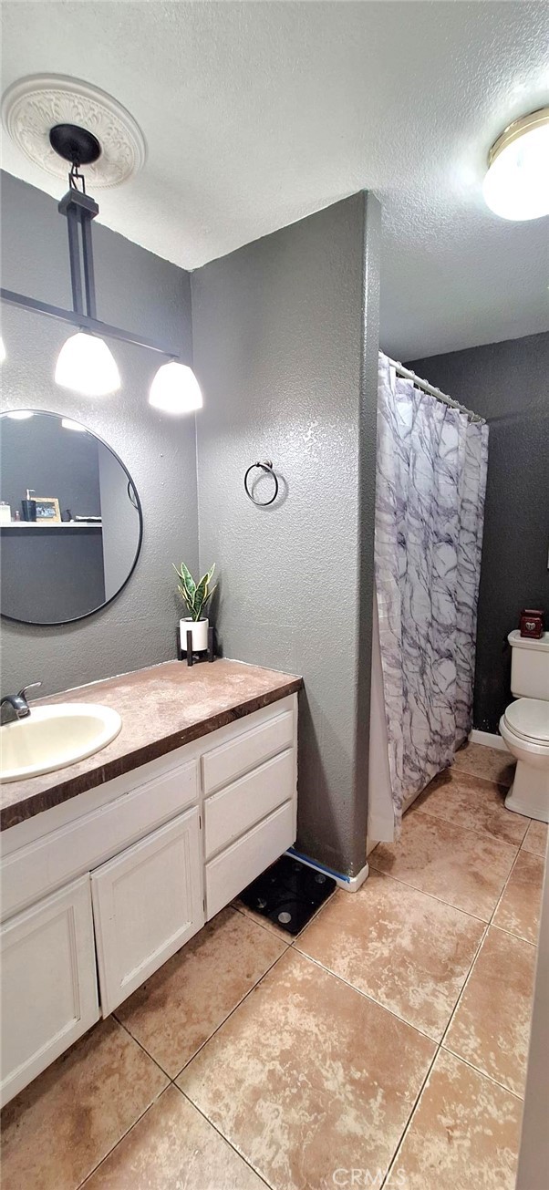 14822 Crofton Lane Helendale, CA 92342 - Photo 27 of 33 a spacious bathroom with a double vanity sink and a mirror
