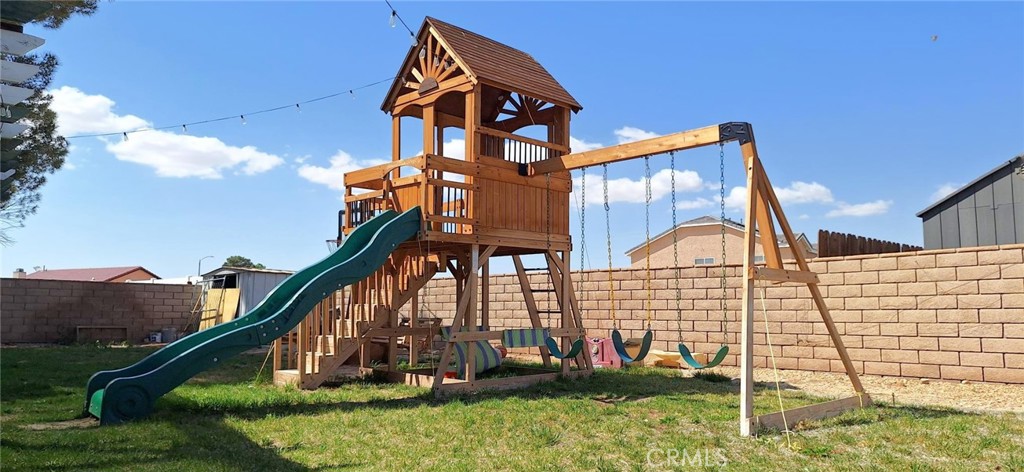 14822 Crofton Lane Helendale, CA 92342 - Photo 30 of 33 a view of a house with a yard