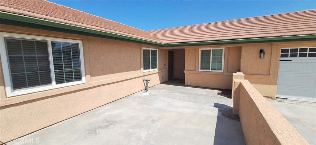 14822 Crofton Lane Helendale, CA 92342 - Photo 3 of 33 a view of house with large windows