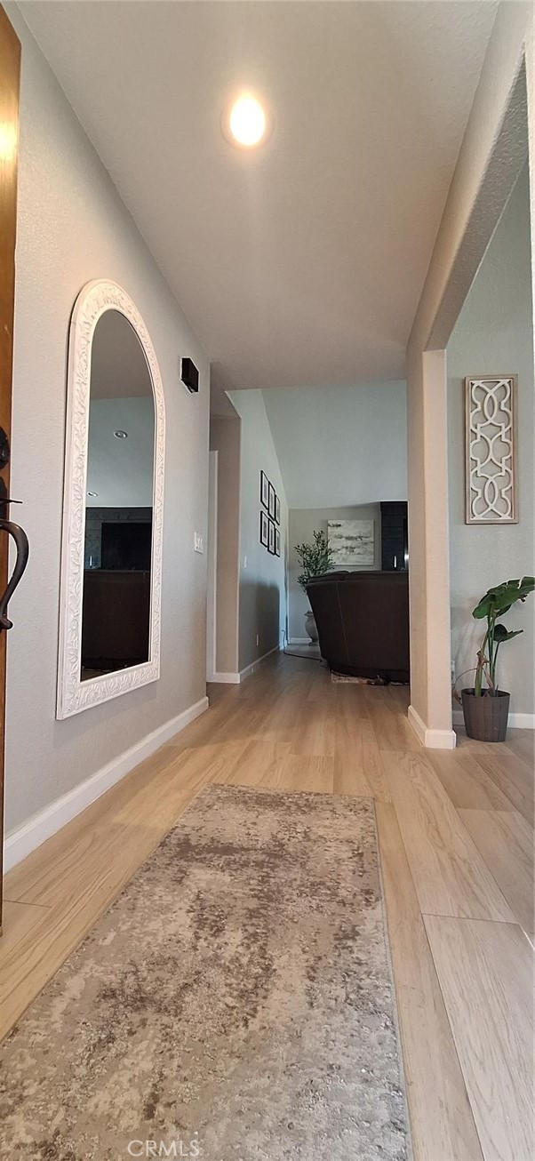 14822 Crofton Lane Helendale, CA 92342 - Photo 4 of 33 a view of empty room with fireplace and windows