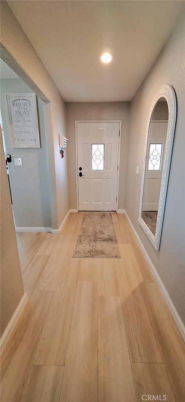 14822 Crofton Lane Helendale, CA 92342 - Photo 5 of 33 a view of a livingroom with wooden floor and window
