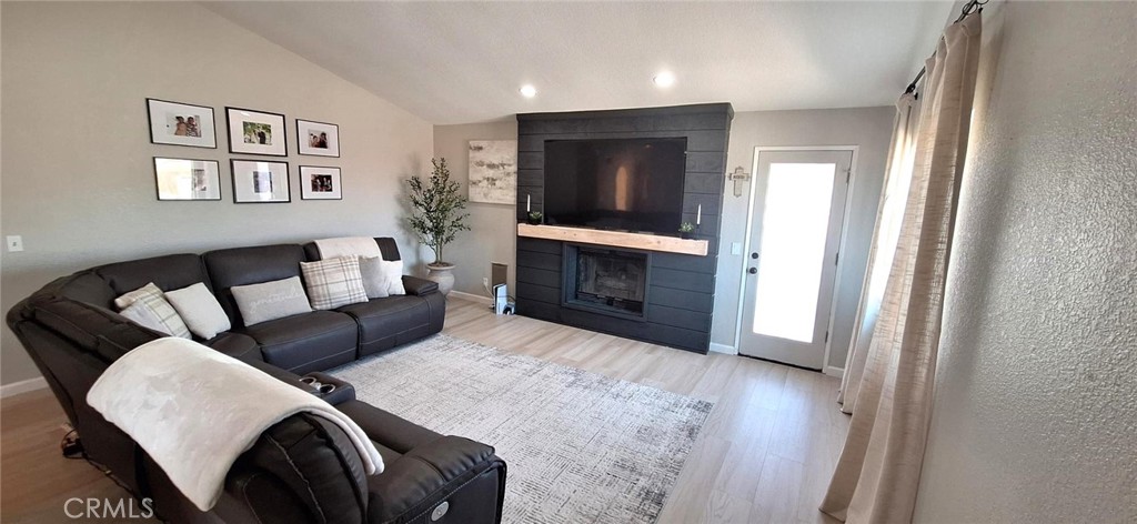 14822 Crofton Lane Helendale, CA 92342 - Photo 7 of 33 a living room with furniture and a fireplace