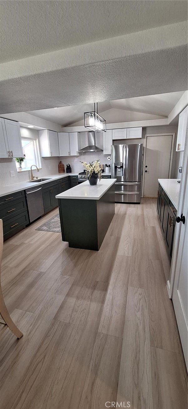 14822 Crofton Lane Helendale, CA 92342 - Photo 10 of 33 a large kitchen with kitchen island a large counter space a sink a stove and cabinetry