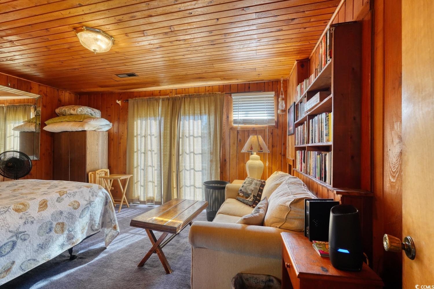 350 Underwood Drive Murrells Inlet, SC 29576 - Photo 22 of 36 Carpeted bedroom with wooden walls and wooden ceiling