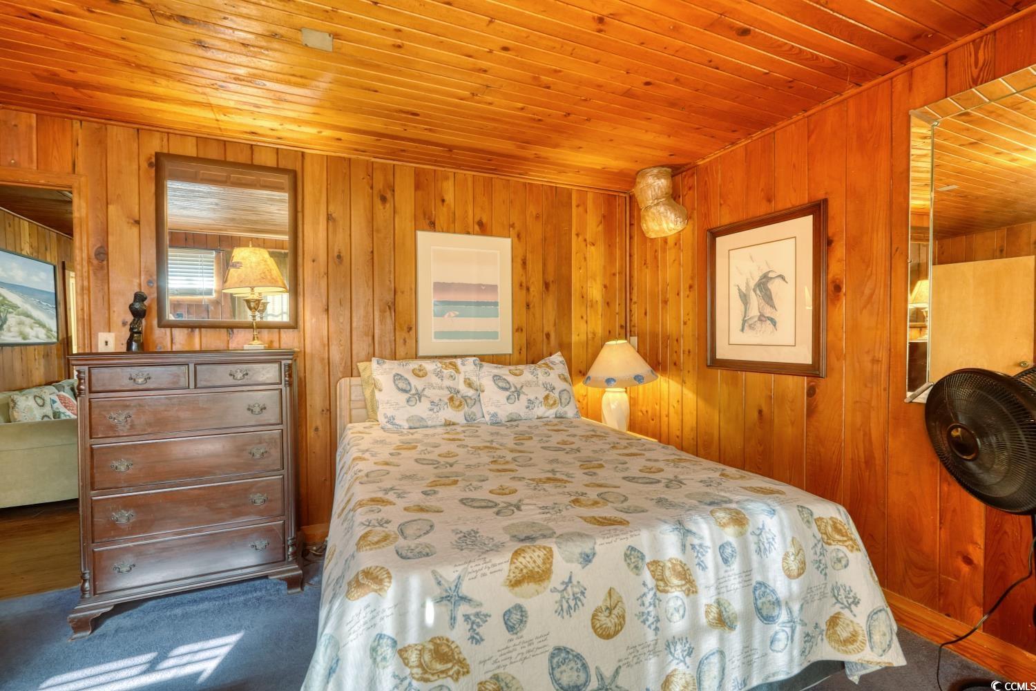 350 Underwood Drive Murrells Inlet, SC 29576 - Photo 23 of 36 Carpeted bedroom with wood ceiling and wooden walls