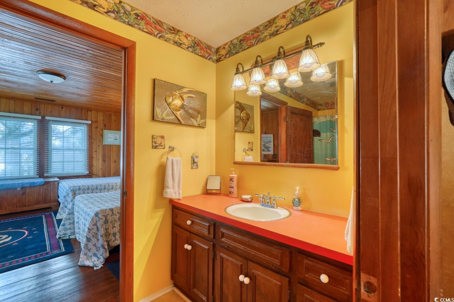 350 Underwood Drive Murrells Inlet, SC 29576 - Photo 30 of 36 Full bathroom with vanity, wood finished floors, ensuite bath, and a shower