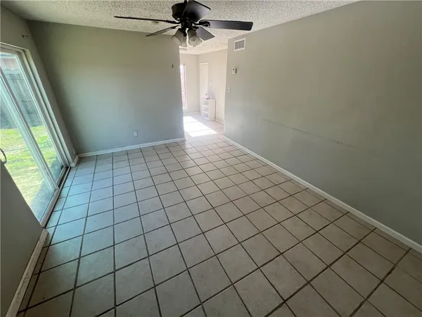 en empty room with wooden floor