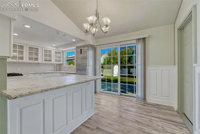 a kitchen with stainless steel appliances granite countertop a sink and dish washer