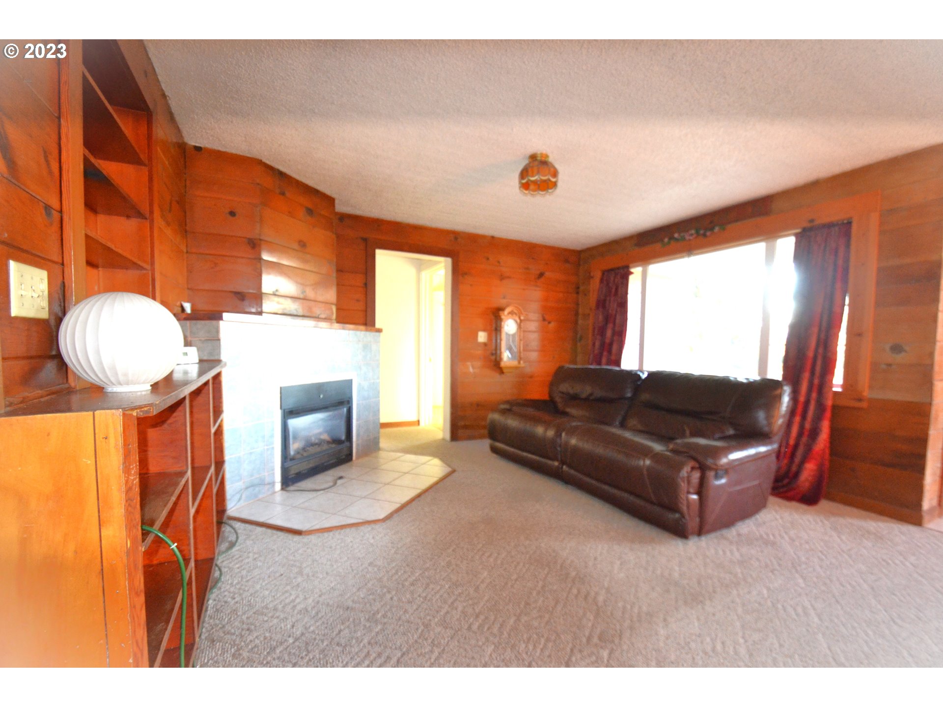 1985 Roseburg Road Myrtle Point, OR 97458 - Photo 5 of 29 a living room with furniture and a fireplace