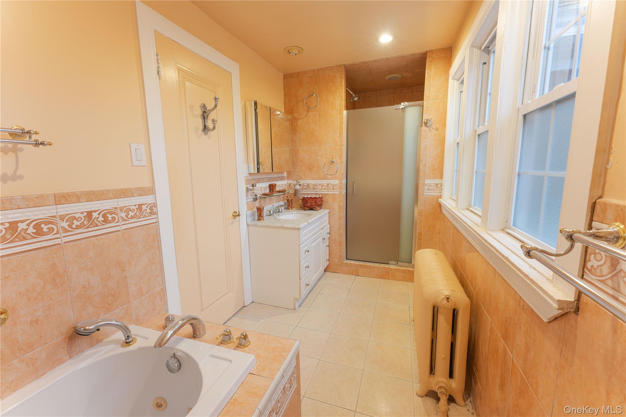 26 Overlook Circle New Rochelle, NY 10804 - Photo 7 of 15 a bathroom with a tub sink and mirror