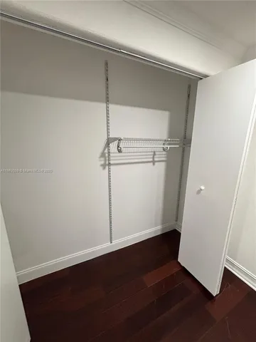 an empty room with wooden floor