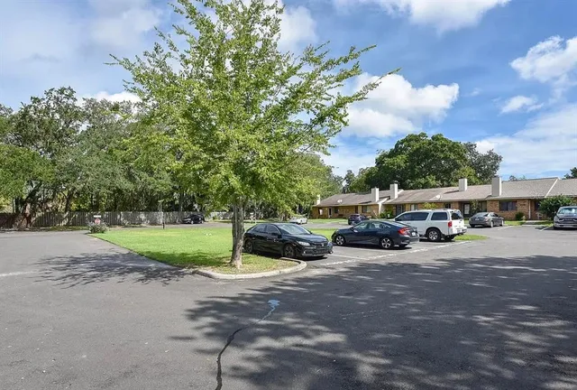 a view of a car parked in front of a house