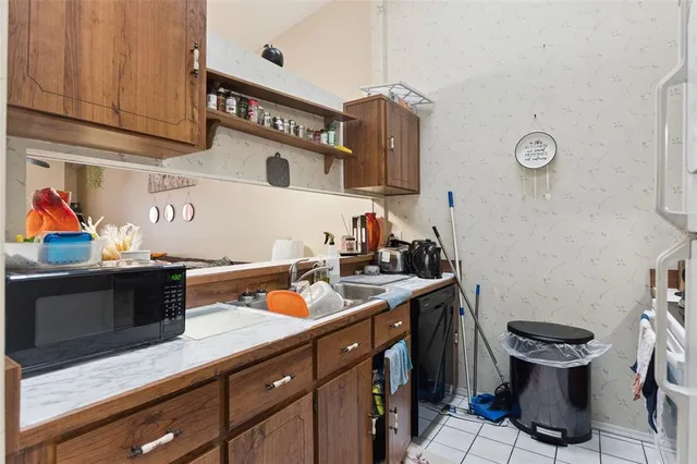 a utility room with sink dryer and washer