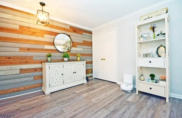 a view of an empty room and wooden floor