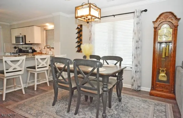 a view of a dining room with furniture and window