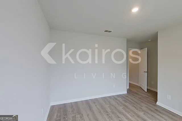 a view of hallway with wooden floor