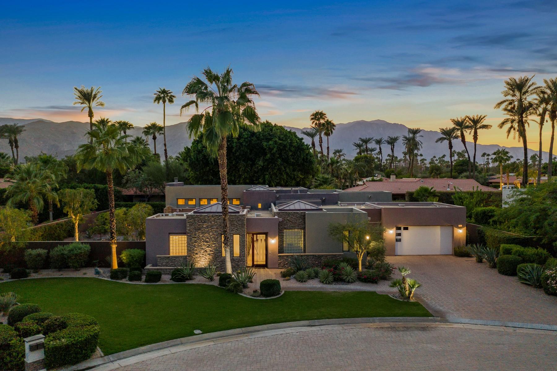 a view of a house with a garden and car parked